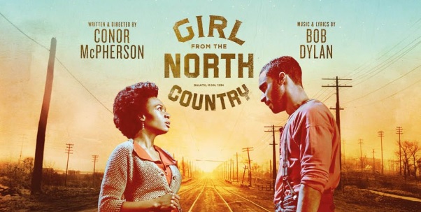 Girl From The North Country Bristol - Theatre marketing image of an american street with light blue bleeding into the sunset. In the foreground are two actors in period dress from the 1930s. In the centre is the musical's logo in gold lettering in a circular layout