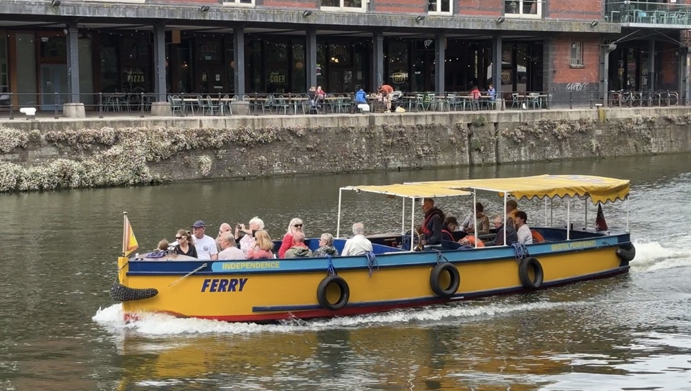Bristol Ferry Boats - The recognisable yellow and blue boat sails down the Bristol Harbourside packed with tourists